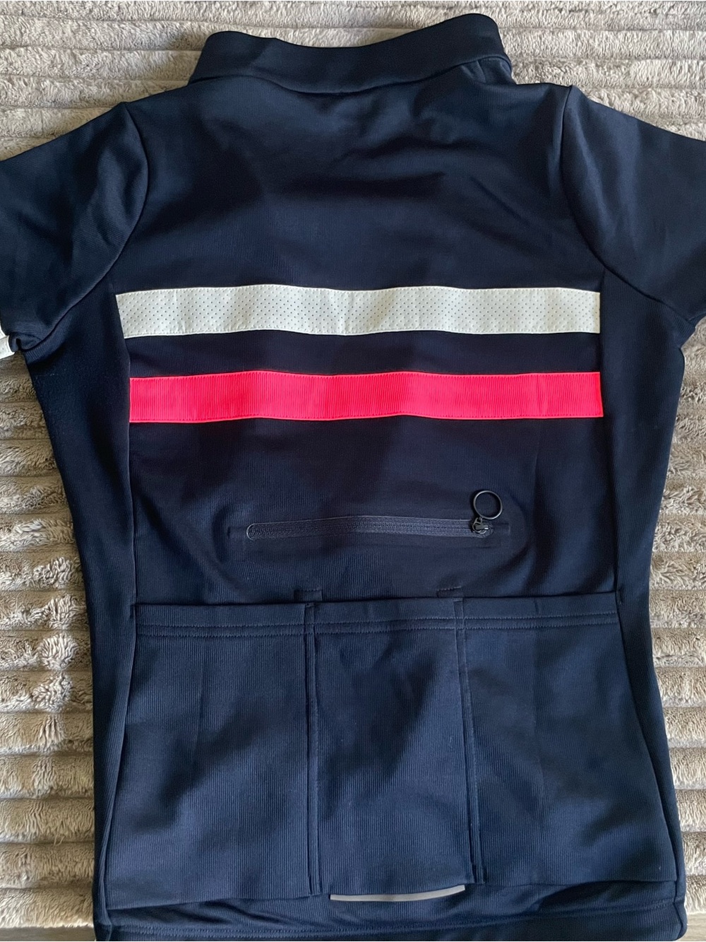 Rapha navy cycling jersey with white and bright pink stripes